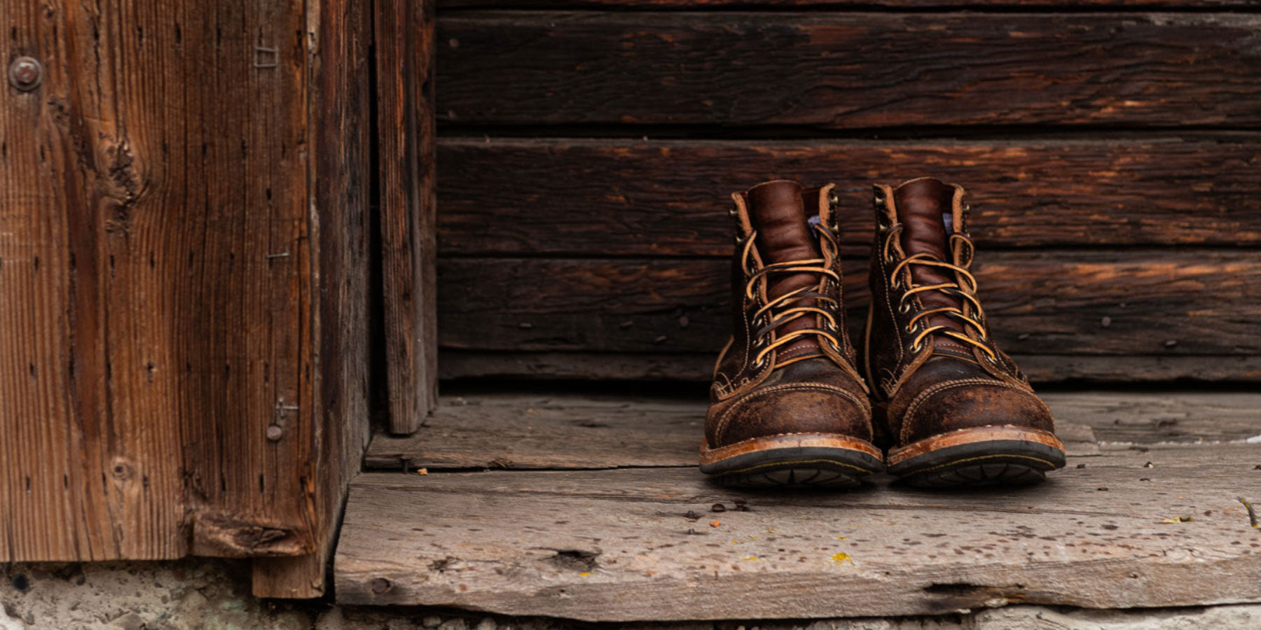 well worn in pair of truman boots in java waxed flesh leather heavy patina