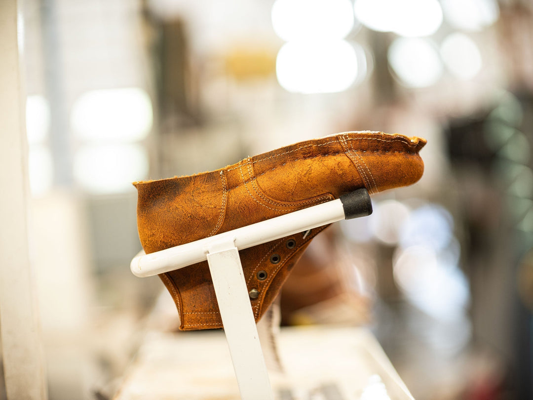 coach rambler boot in production after being stapled/lasted