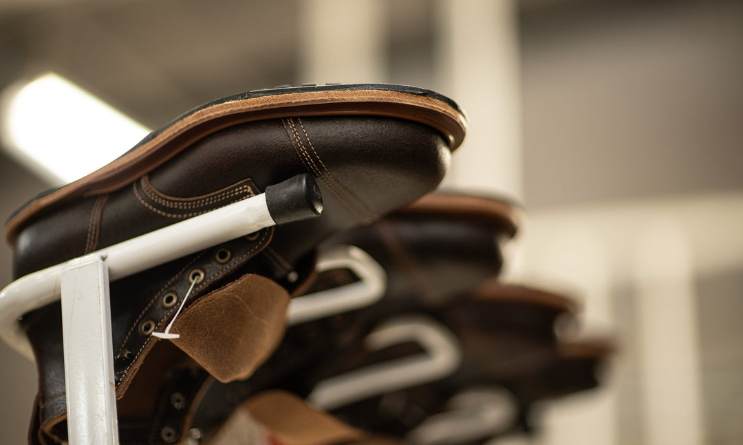 upside down java waxed flesh boots in production rack