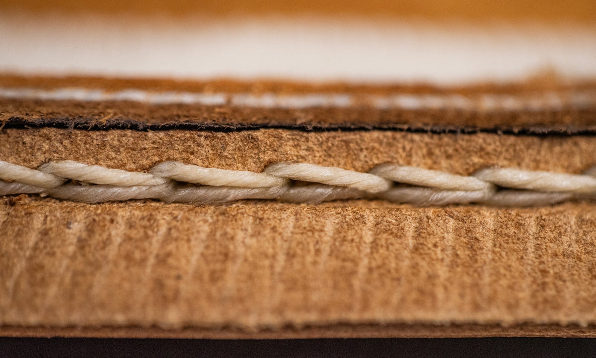 close-up macro shot of stitching on welt underside
