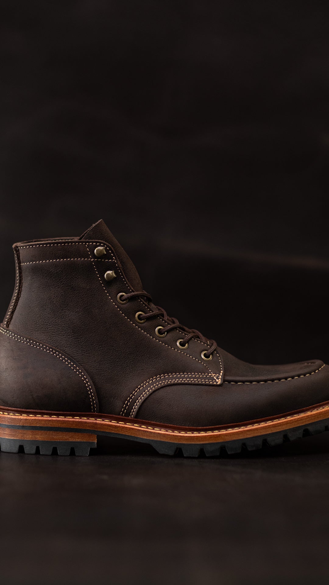 side view of brown kudu leather boot on brown kudu leather background