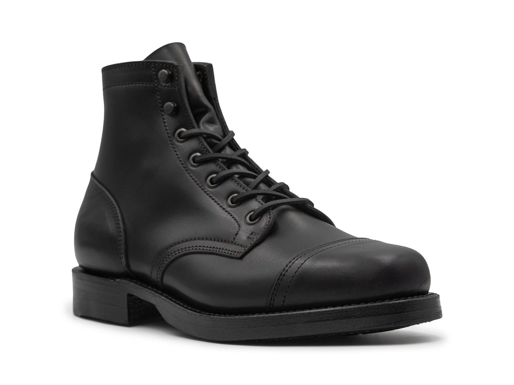three-quarter view of black chromexcel leather boot on white background