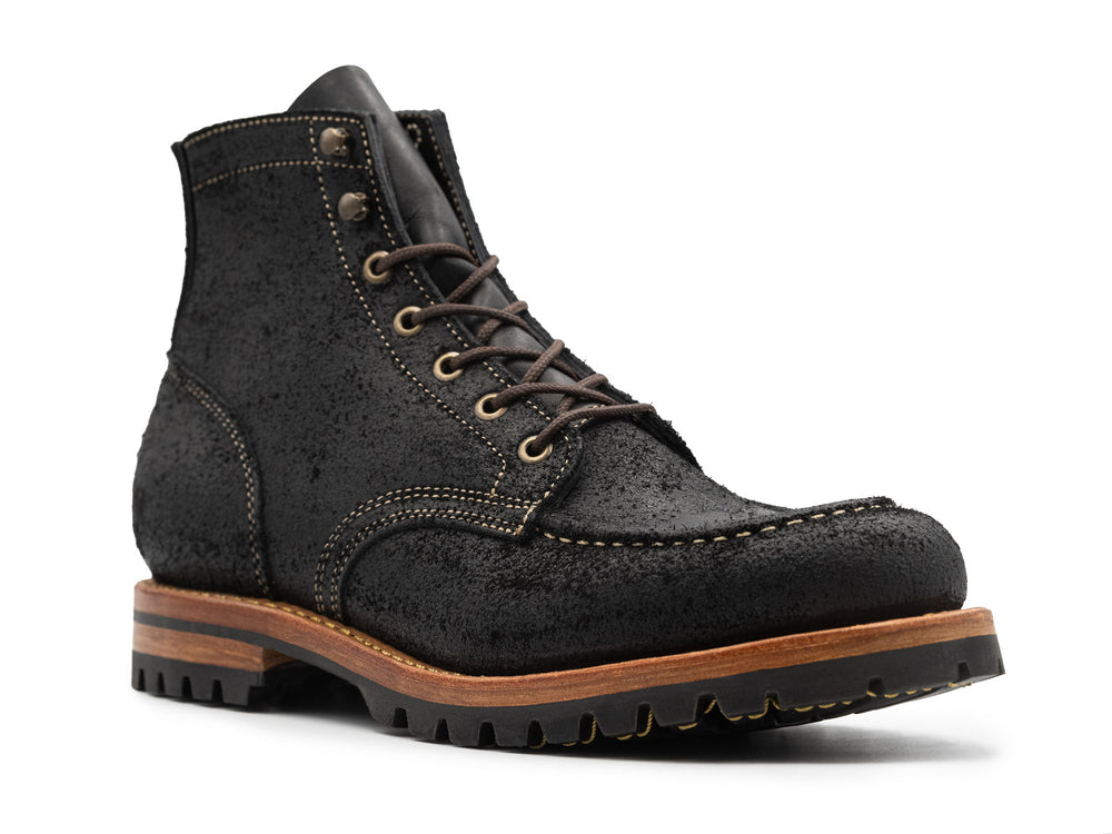 3qtr view of black moc toe boots on white background