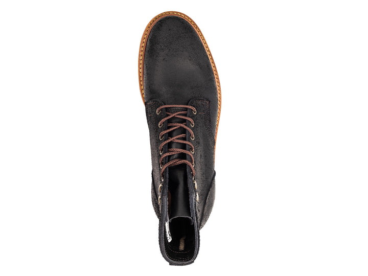 topdown view of black rough out boot on white background
