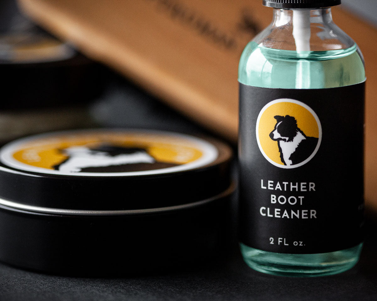Boot cleaner spray bottle next to boot leather protector