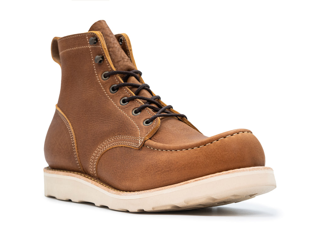 3qtr view of light brown leather moc toe boot on white background