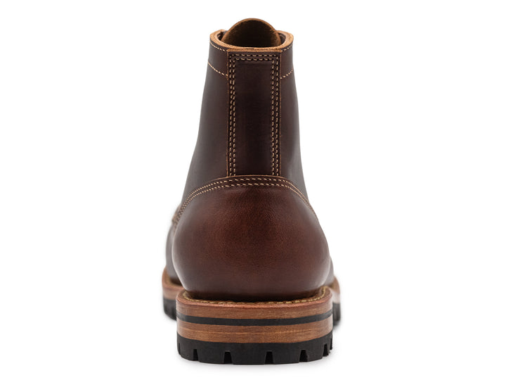 brown leather moc toe boot back view on white background