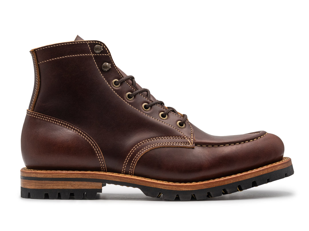 brown leather moc toe boot side profile on white background