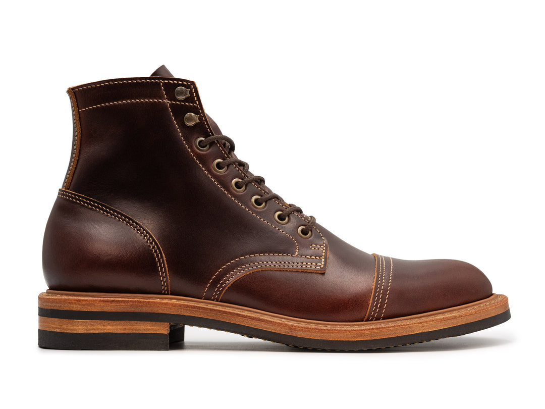 brown leather boot on white background side view