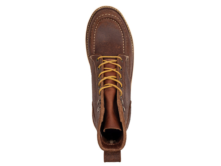 topdown view of brown leather moc toe boot on white background