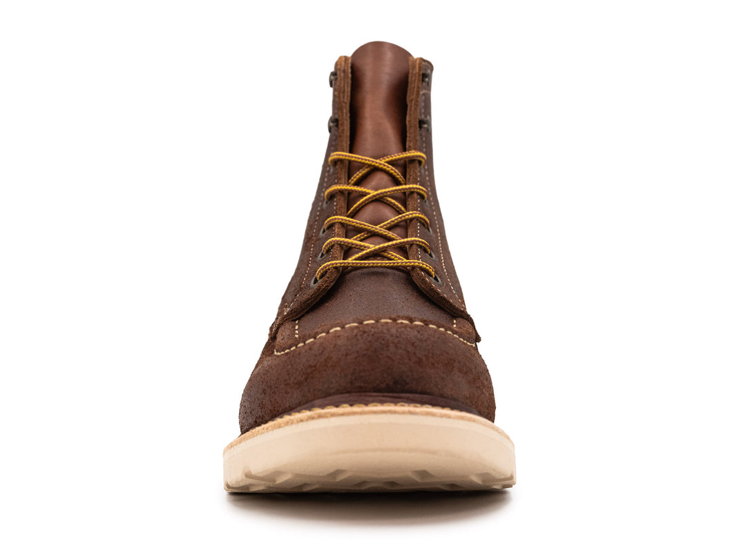 front view of brown oiled rough out leather moc toe boot on white background
