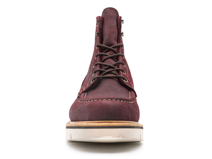 front view of burgundy rambler leather moc toe boot on white background