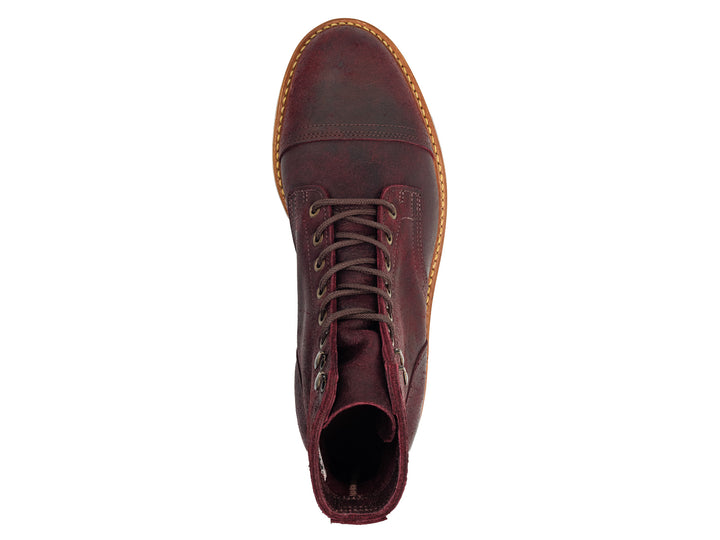 topdown view of dark burgundy leather boot on white background
