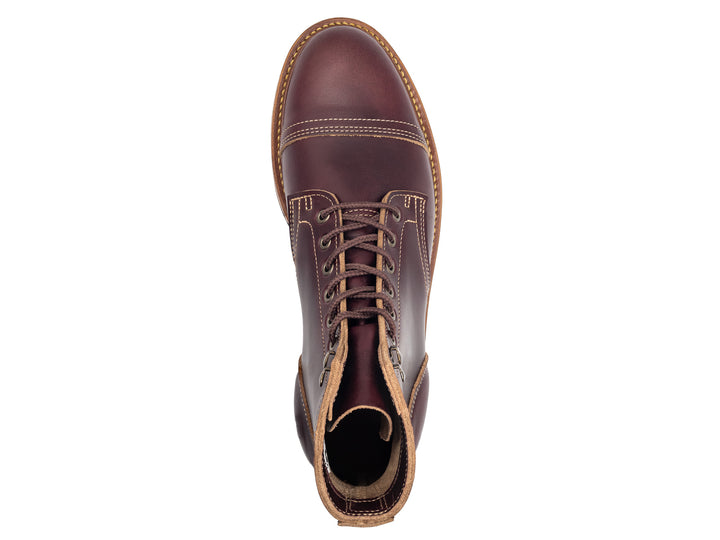 topdown view of dark burgundy leather boot on white background