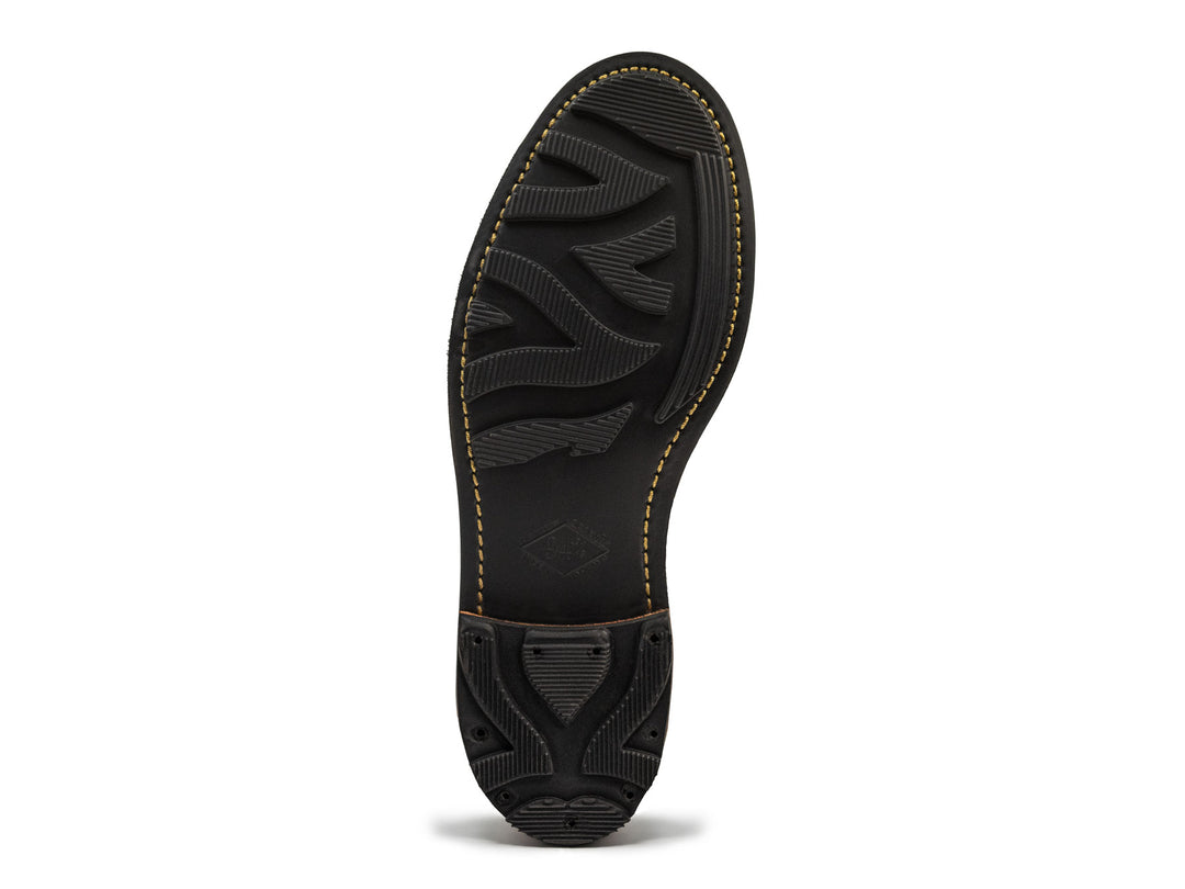 bottom view of black rubber dainite ridgeway sole showing unique tread pattern