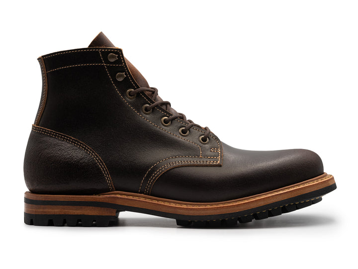 side view of java waxed flesh plain toe boot on white background
