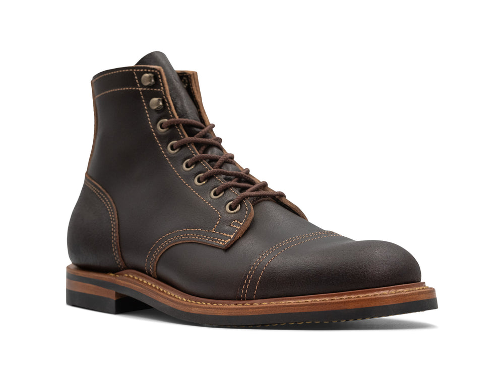 three-quarter view of java waxed leather boot on white background