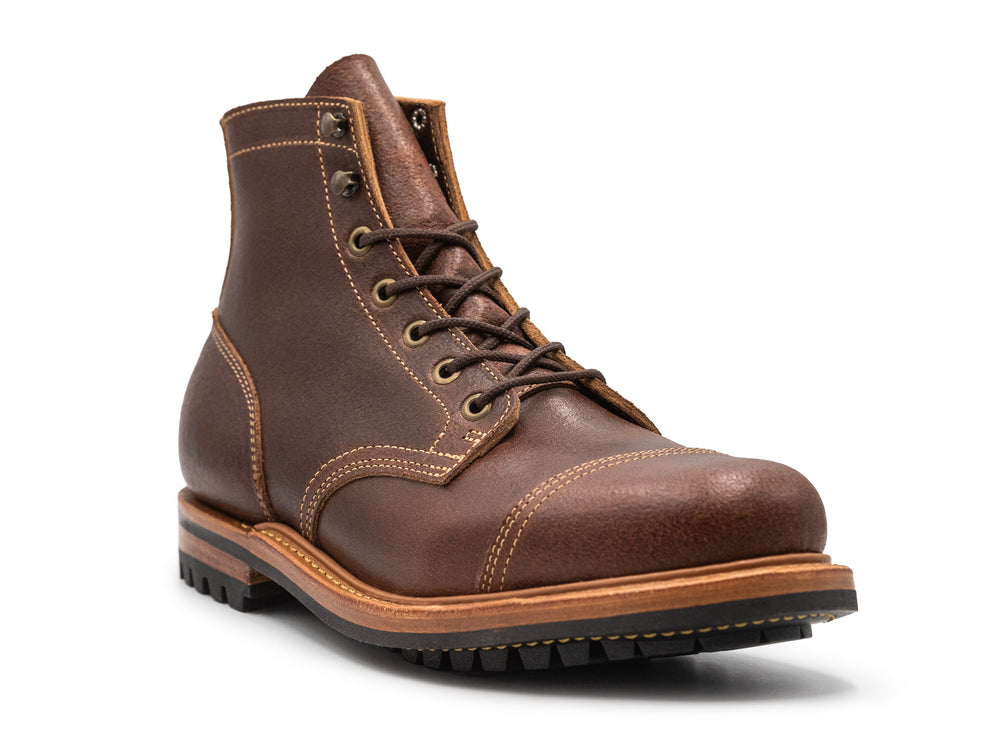 brown leather cap toe boot on a white background 3QTR view