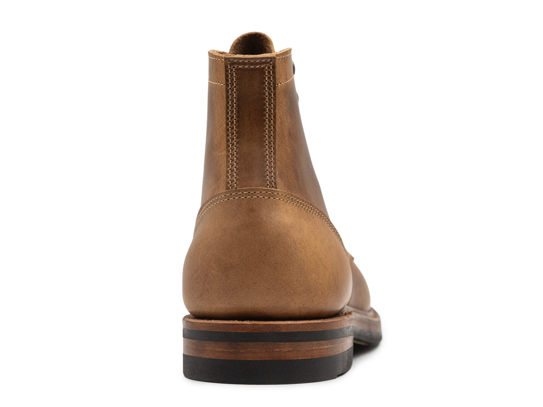 rear view of sesame double shot leather boot on white background