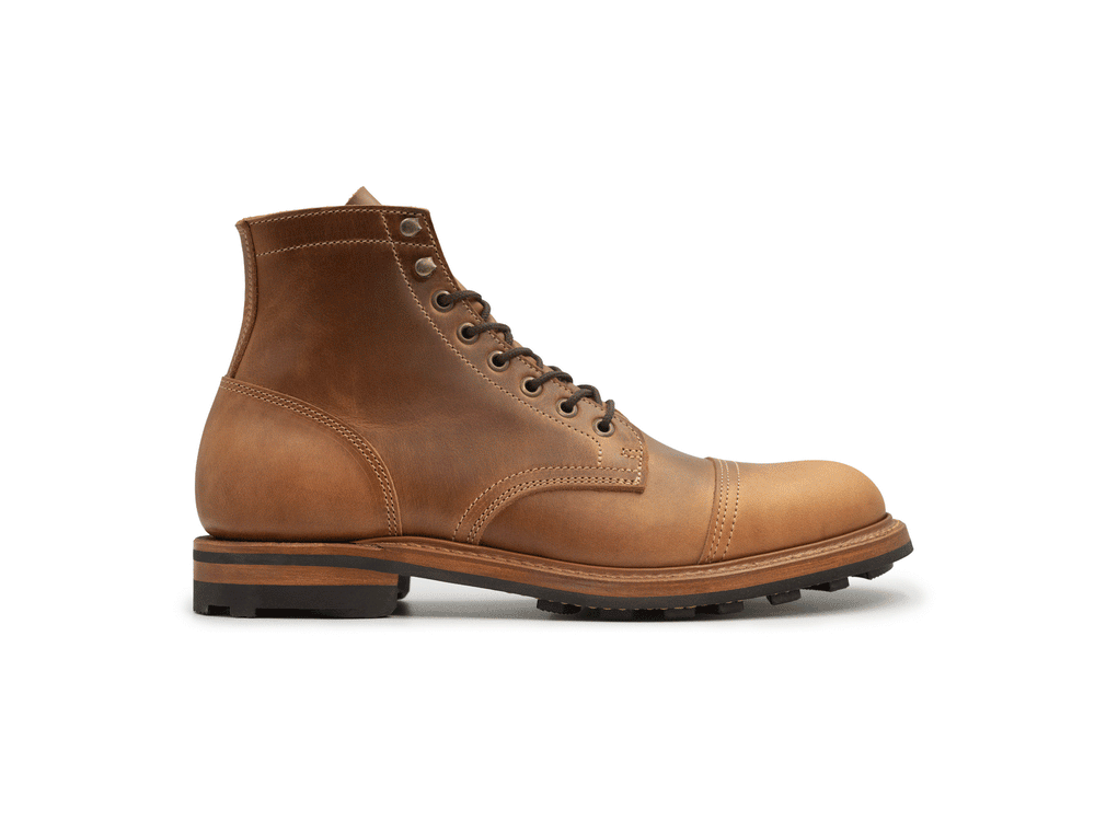 Rotating 360° animation of single tan brown leather lace-up ankle boot with a cap toe and stacked sole, shown against a plain white background