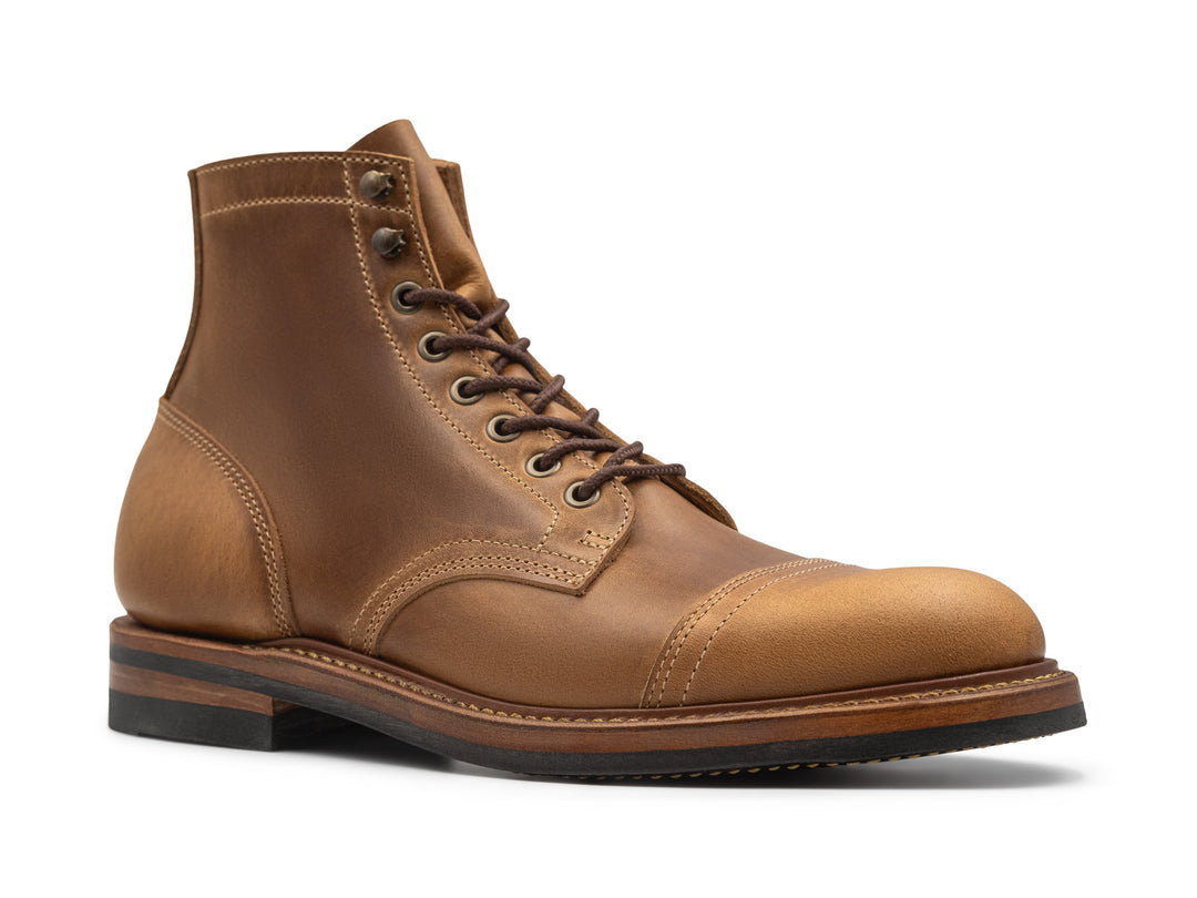 three quarter view of sesame double shot leather boot on white background