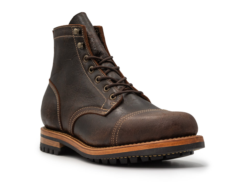 3QTR view of brown textured leather boot on white background