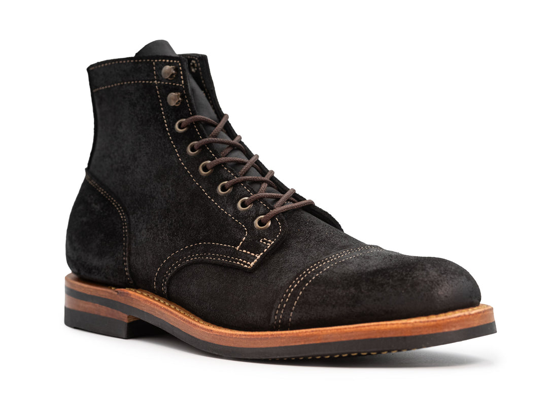 3qtr view of black leather boot on white background