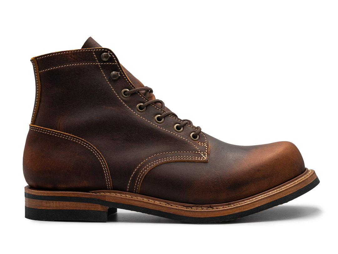 rich brown leather boot on white background