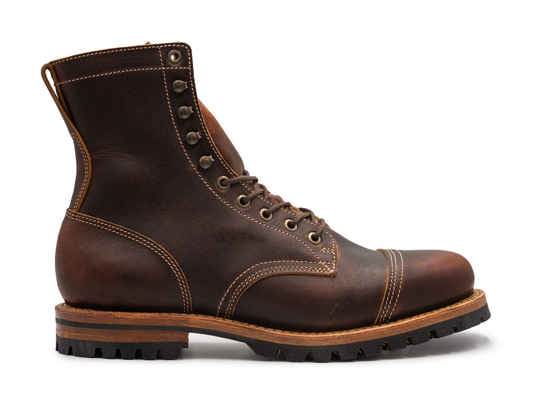 auburn brown leather boot on a white background side view