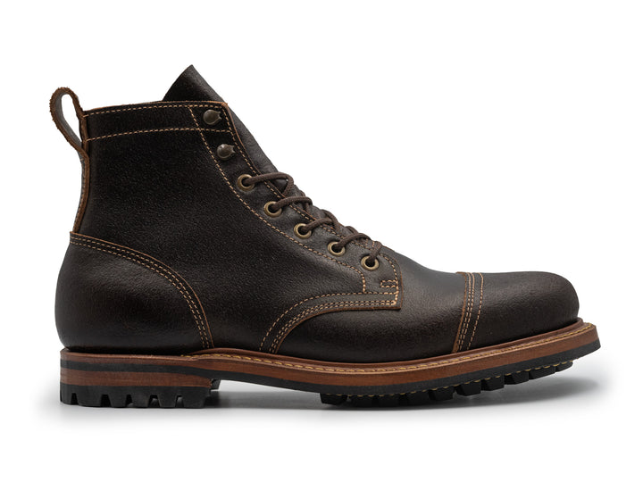 brown waxed leather boot on white background