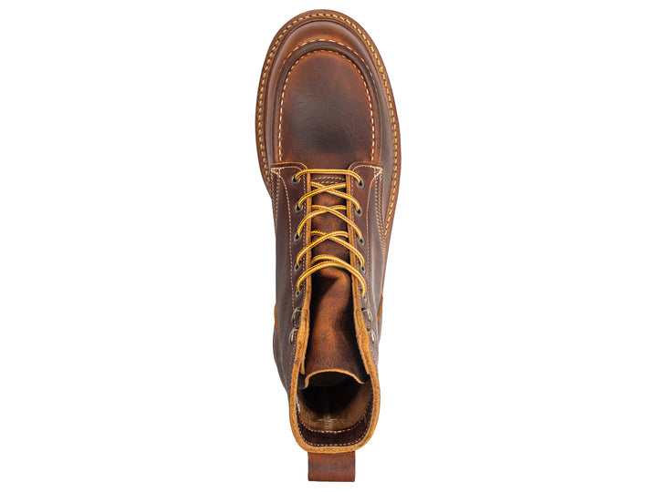 topdown view of rustic brown leather moc toe boot on white background
