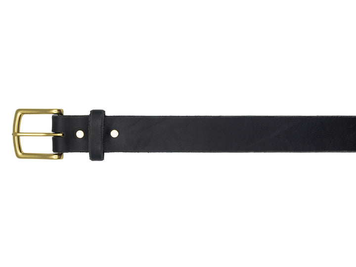 brass buckle of black veg tan leather belt on white background
