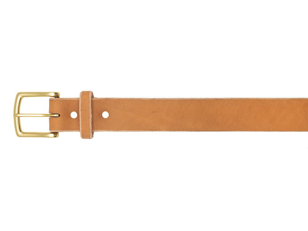 buckle of natural veg tan leather belt on white background