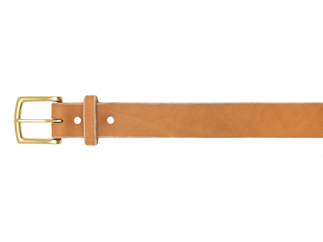 buckle of natural veg tan leather belt on white background