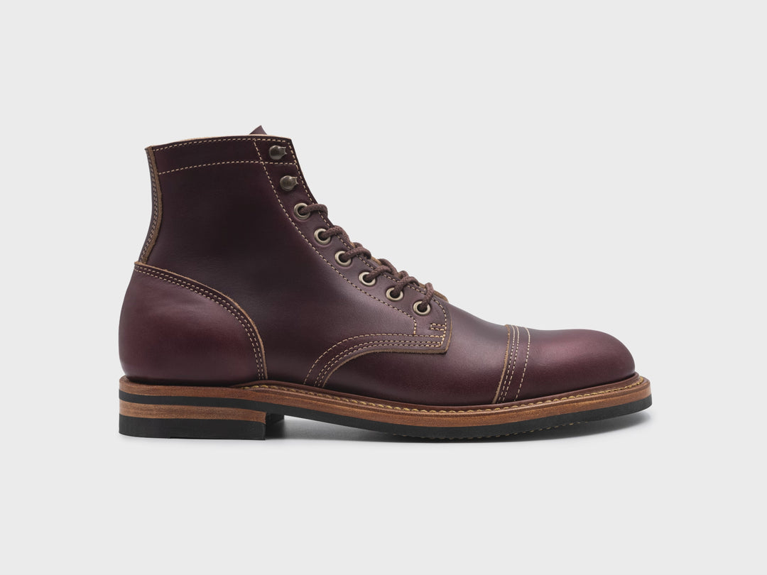 rotating 360° view of dark burgundy leather boot on white background