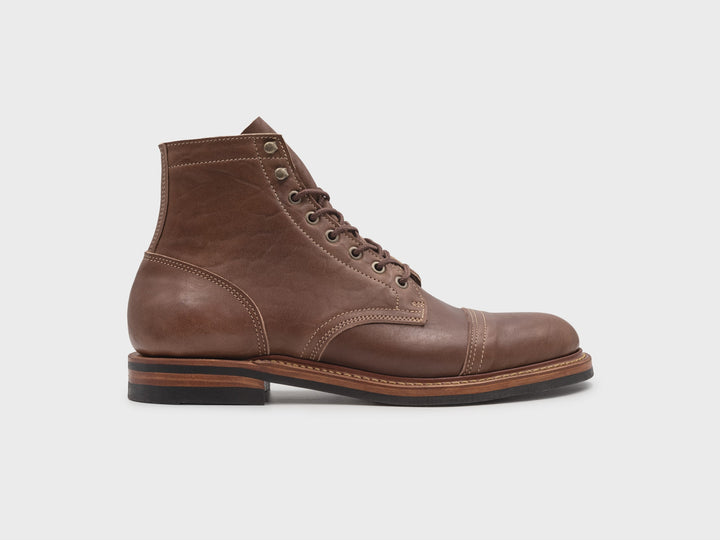 rotating video of light brown leather boot on white background